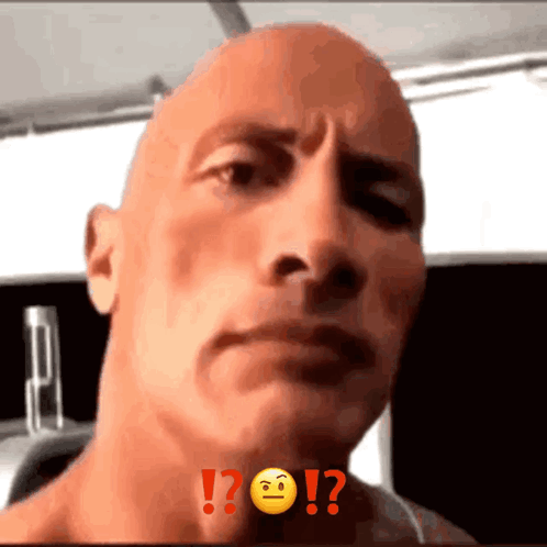 A Close Up Of A Man 'S Face With A Smiley Face And The Words ! ? On It GIF