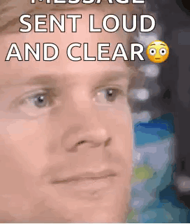 A Close Up Of A Man 'S Face With A Smiley Face And The Words `` Sent Loud And Clear '' . GIF