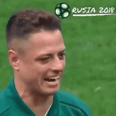 A Close Up Of A Man 'S Face With A Soccer Ball In The Background And The Words Russia 2018 On The Bottom . GIF