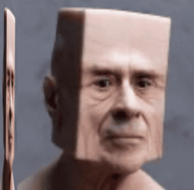 A Close Up Of A Man 'S Face With A Square Head . GIF