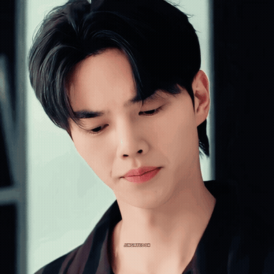 A Close Up Of A Man 'S Face With A Sticker On His Neck That Says Jfkcmeom GIF