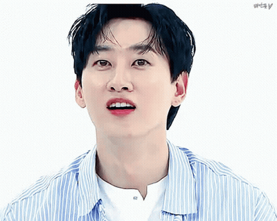 A Close Up Of A Man 'S Face With A Striped Shirt And A Pink Heart GIF