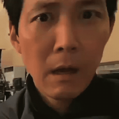 A Close Up Of A Man 'S Face With A Surprised Expression . GIF
