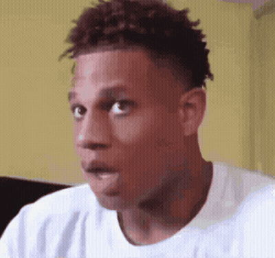 A Close Up Of A Man 'S Face With A Surprised Look On His Face GIF