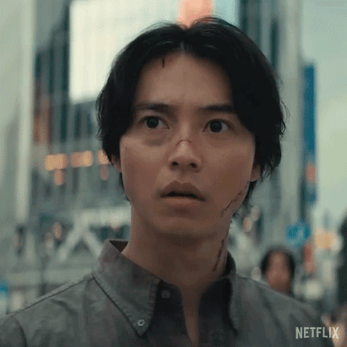A Close Up Of A Man 'S Face With A Surprised Look On His Face In A City . GIF