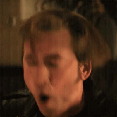 A Close Up Of A Man 'S Face With A Surprised Look On His Face . GIF