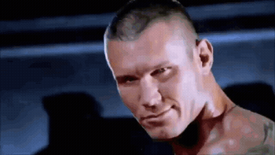 A Close Up Of A Man 'S Face With A Tattoo On His Arm . GIF