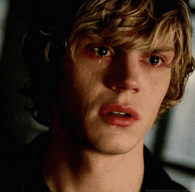 A Close Up Of A Man 'S Face With A Tear Coming Out Of His Eye GIF