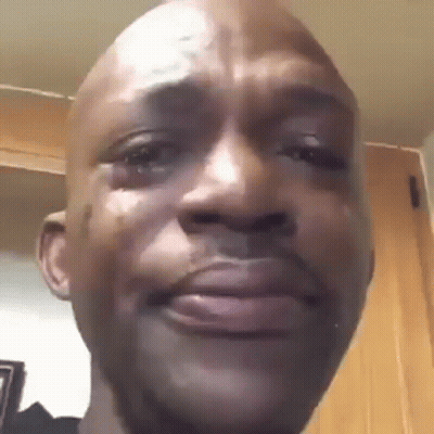 A Close Up Of A Man 'S Face With A Tear Coming Out Of His Eye . GIF