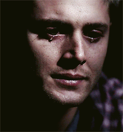A Close Up Of A Man 'S Face With A Tear Running Down His Cheek GIF