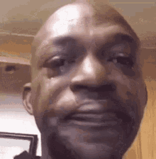 A Close Up Of A Man 'S Face With A Tear Running Down His Eye . GIF