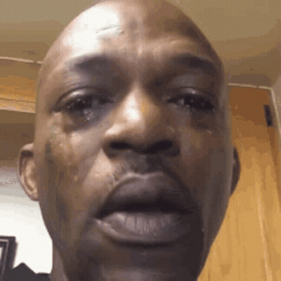 A Close Up Of A Man 'S Face With A Tear Running Down His Face . GIF