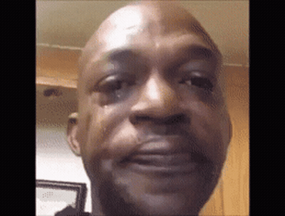 A Close Up Of A Man 'S Face With A Tear Running Down His Face . GIF