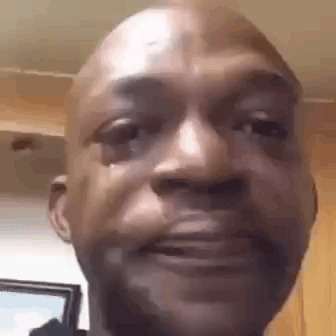A Close Up Of A Man 'S Face With A Tear Running Down His Face . GIF