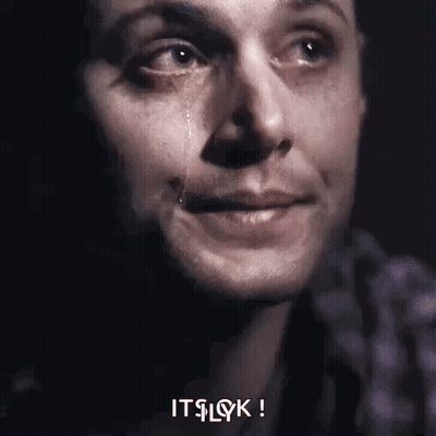 A Close Up Of A Man 'S Face With A Tear Running Down His Face . GIF