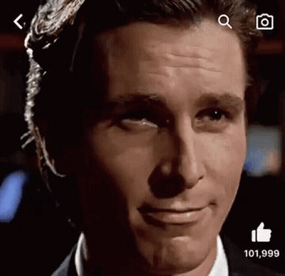 A Close Up Of A Man 'S Face With A Thumbs Up Sign . GIF