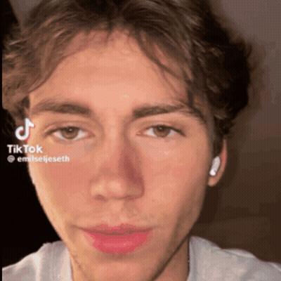 A Close Up Of A Man 'S Face With A Tiktok Watermark On It GIF