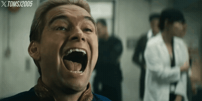 A Close Up Of A Man 'S Face With A Tomsj 2005 Watermark GIF