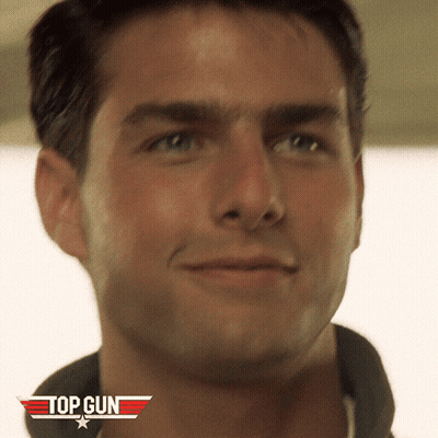 A Close Up Of A Man 'S Face With A Top Gun Logo On The Bottom GIF