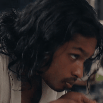 A Close Up Of A Man 'S Face With A Towel Around His Neck GIF