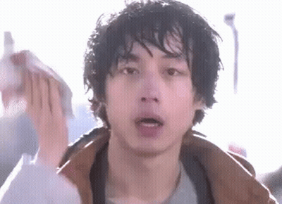 A Close Up Of A Man 'S Face With A Towel On His Head . GIF