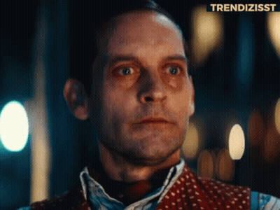 A Close Up Of A Man 'S Face With A Trendizsst Logo Above Him GIF