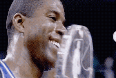 A Close Up Of A Man 'S Face With A Trophy On It GIF
