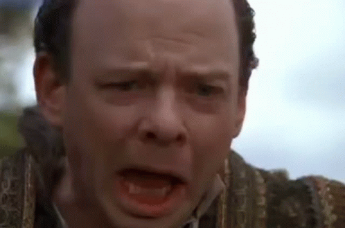 A Close Up Of A Man 'S Face With A Very Angry Look On His Face . GIF