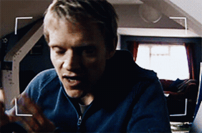 A Close Up Of A Man 'S Face With A White Arrow Pointing To The Left GIF