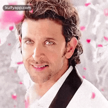 A Close Up Of A Man 'S Face With A White Shirt And A Black Tie . GIF