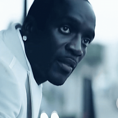 A Close Up Of A Man 'S Face With A White Shirt On GIF