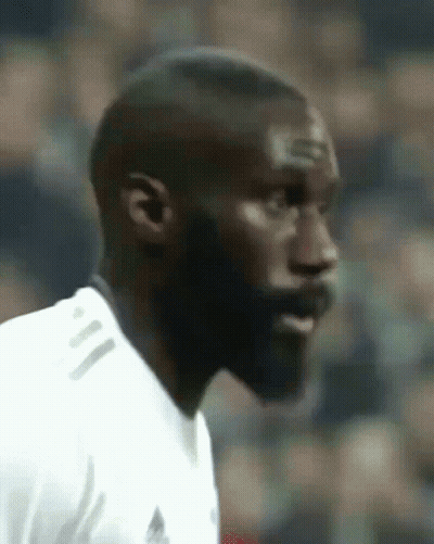 A Close Up Of A Man 'S Face With A White Shirt On GIF