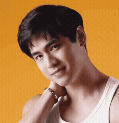 A Close Up Of A Man 'S Face With A White Tank Top On GIF
