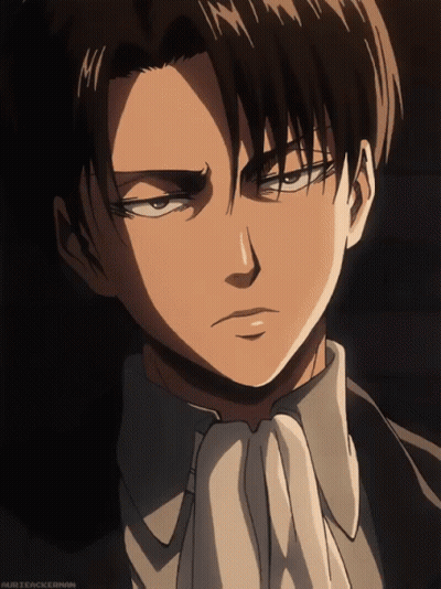 A Close Up Of A Man 'S Face With A White Tie And A Black Suit GIF