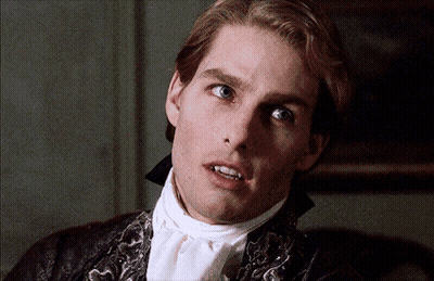 A Close Up Of A Man 'S Face With A White Tie GIF