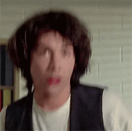 A Close Up Of A Man 'S Face With A Wig On . GIF