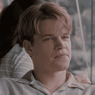A Close Up Of A Man 'S Face With A Woman 'S Arm Around His Shoulder GIF