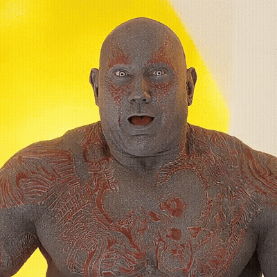 A Close Up Of A Man 'S Face With A Yellow Background GIF
