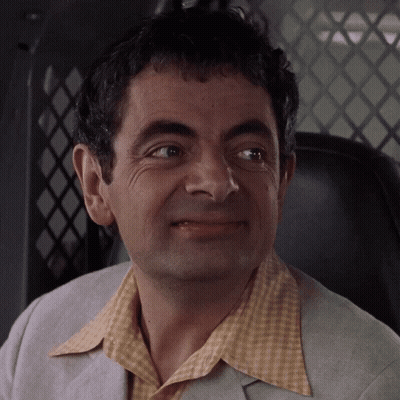 A Close Up Of A Man 'S Face With A Yellow Shirt On GIF