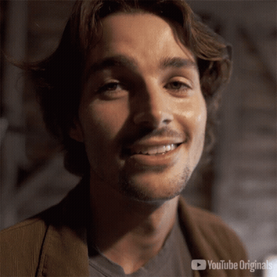 A Close Up Of A Man 'S Face With A Youtube Originals Logo Behind Him GIF