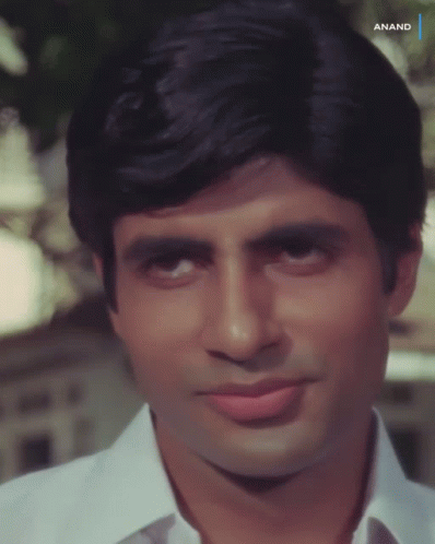 A Close Up Of A Man 'S Face With Anand Written On The Bottom Right GIF