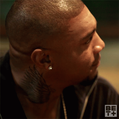 A Close Up Of A Man 'S Face With Be T + Written On The Bottom Right GIF