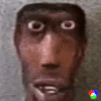 A Close Up Of A Man 'S Face With Big Eyes And A Blurred Background GIF