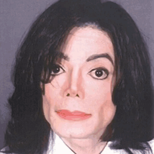 A Close Up Of A Man 'S Face With Black Hair GIF