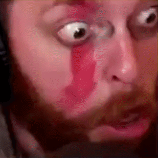 A Close Up Of A Man 'S Face With Blood Coming Out Of His Eyes GIF