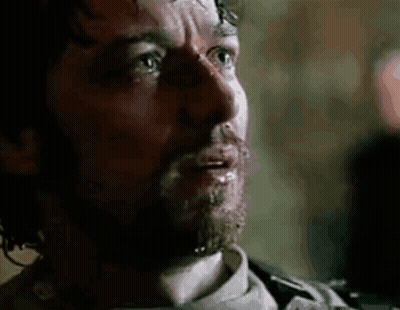 A Close Up Of A Man 'S Face With Blood Coming Out Of His Mouth . GIF