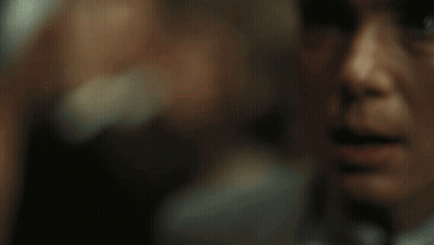A Close Up Of A Man 'S Face With Blue Eyes GIF
