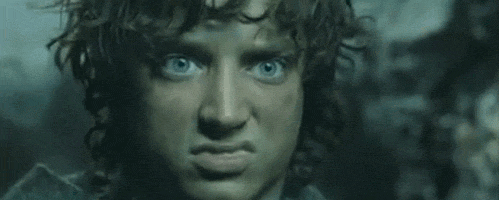A Close Up Of A Man 'S Face With Blue Eyes Making A Face . GIF