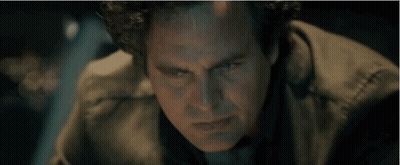 A Close Up Of A Man 'S Face With Blue Eyes GIF