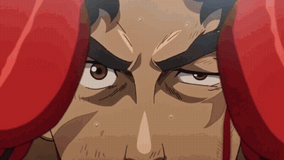 A Close Up Of A Man 'S Face With Boxing Gloves On GIF